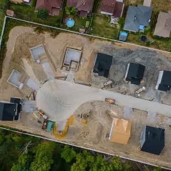 A residential aerial view of a new housing development being built of a new home under construction